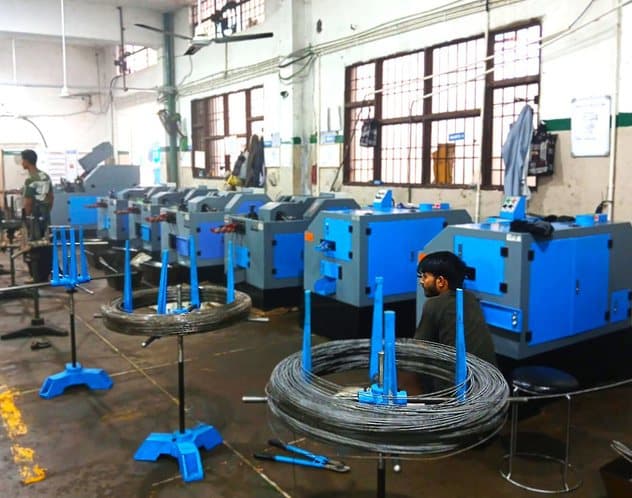 Bank of header machines with wire stands